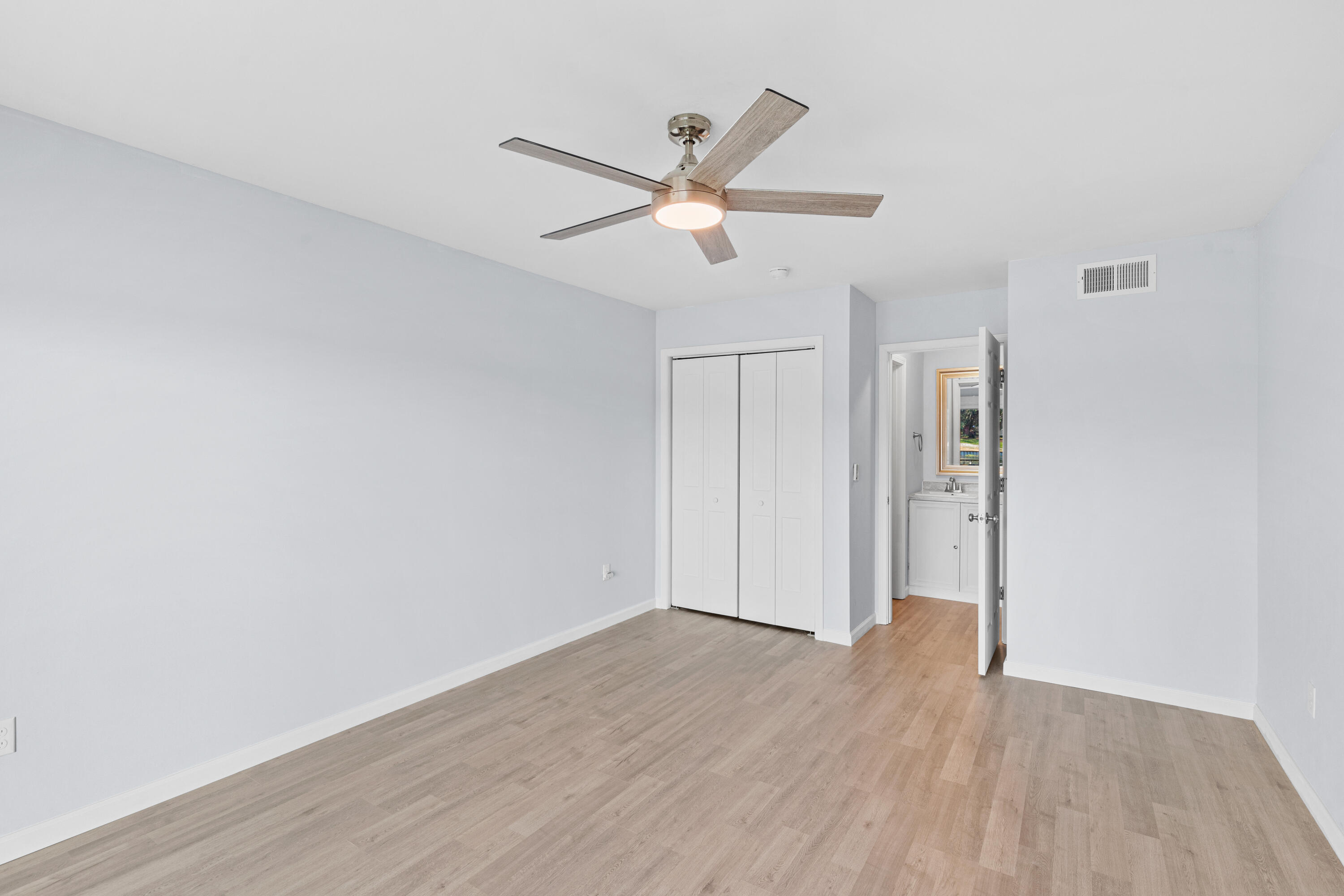 210 Pelham Road, Unit 109B Fort Walton Beach, FL 32547 - Photo 15 of 33 a view of empty room with wooden floor