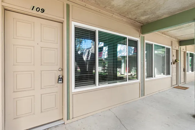 a view of a lake with houses in the back