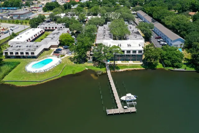 an aerial view of a house with a lake view