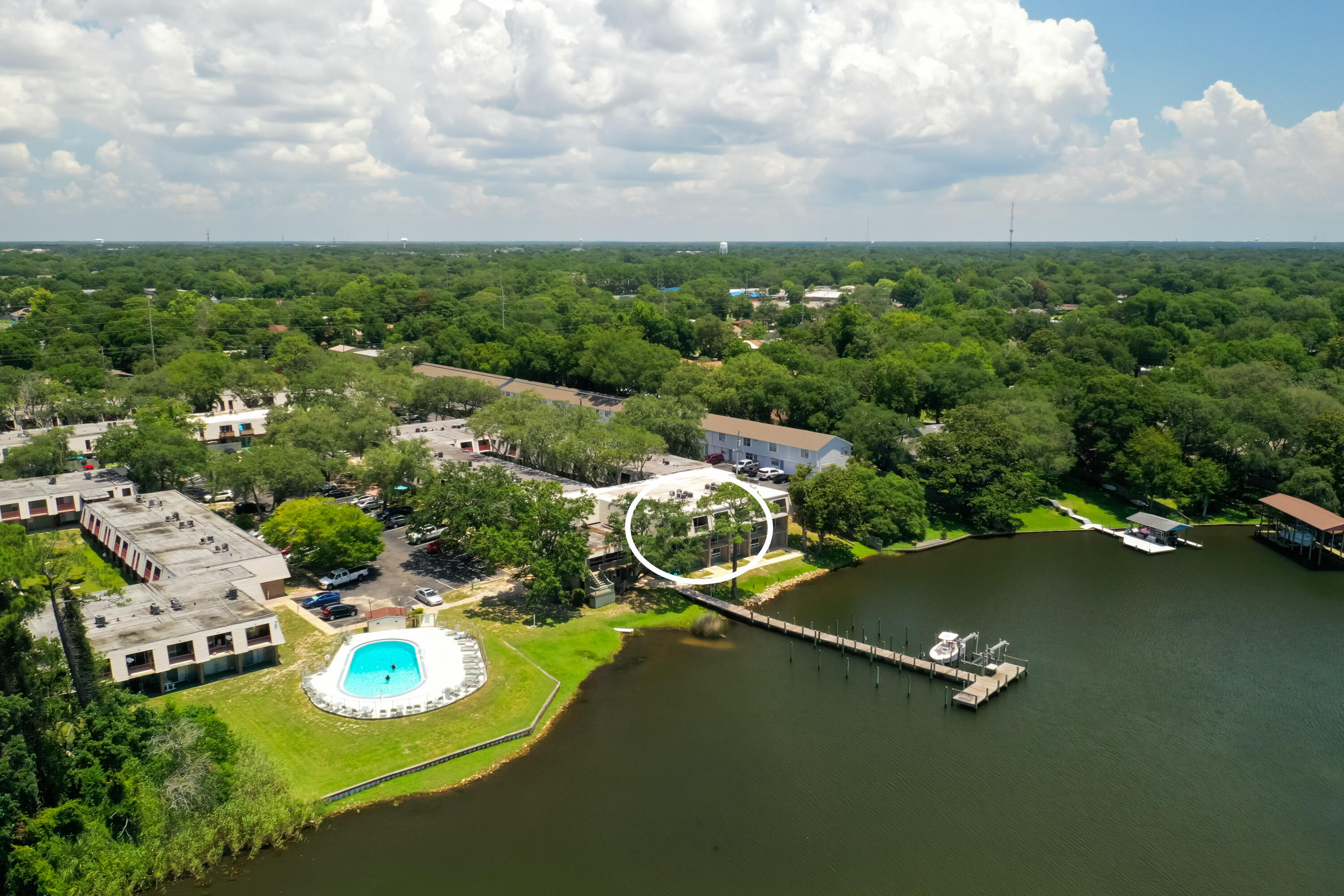 210 Pelham Road, Unit 109B Fort Walton Beach, FL 32547 - Photo 31 of 33 an aerial view of a house with a swimming pool yard and outdoor seating