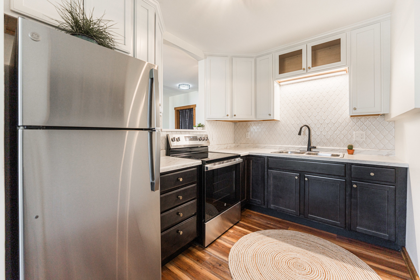 318 West State Street, Unit 318 Sycamore, IL 60178 - Photo 12 of 21 a kitchen with a refrigerator and a sink