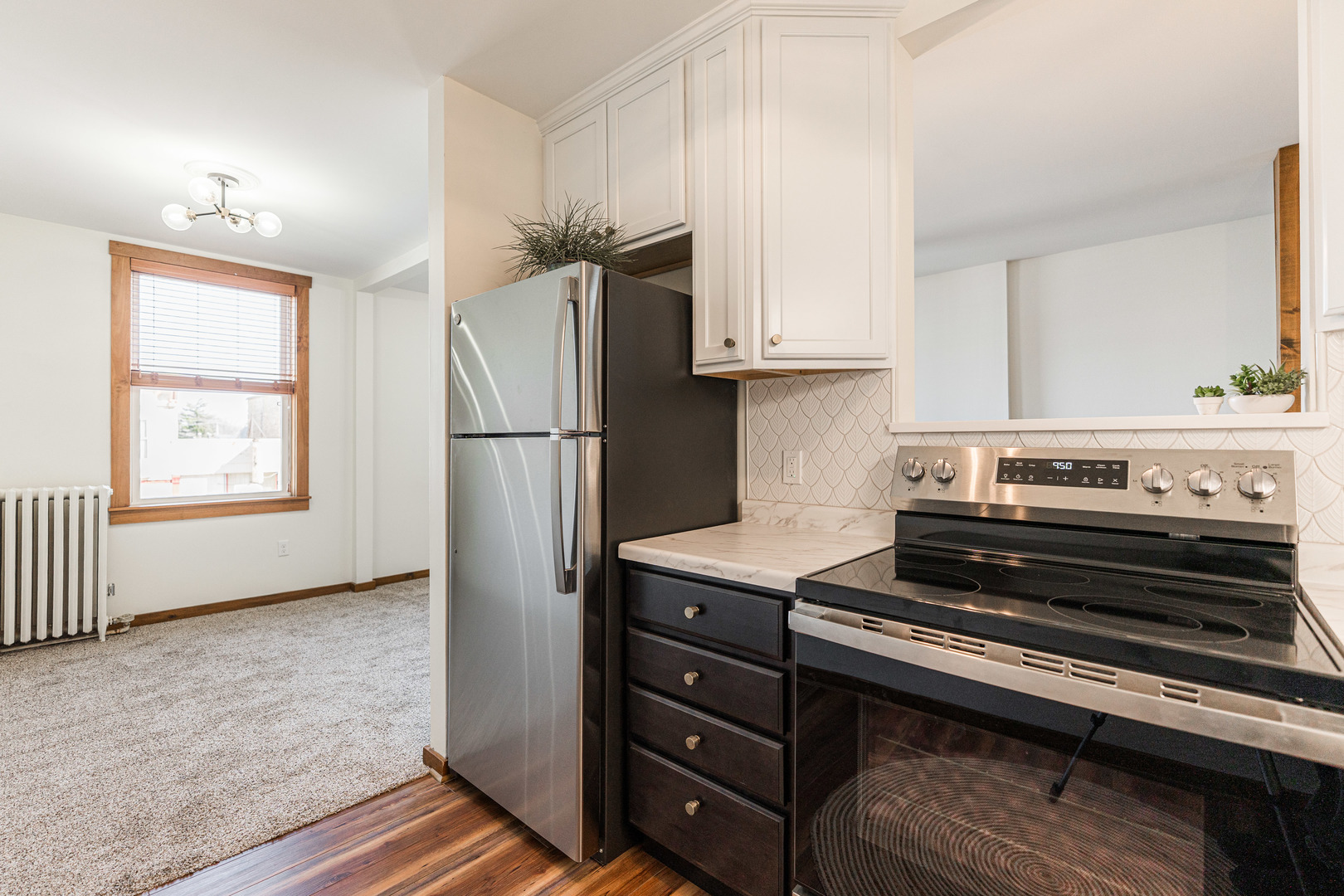 318 West State Street, Unit 318 Sycamore, IL 60178 - Photo 13 of 21 a kitchen with a stove and a refrigerator