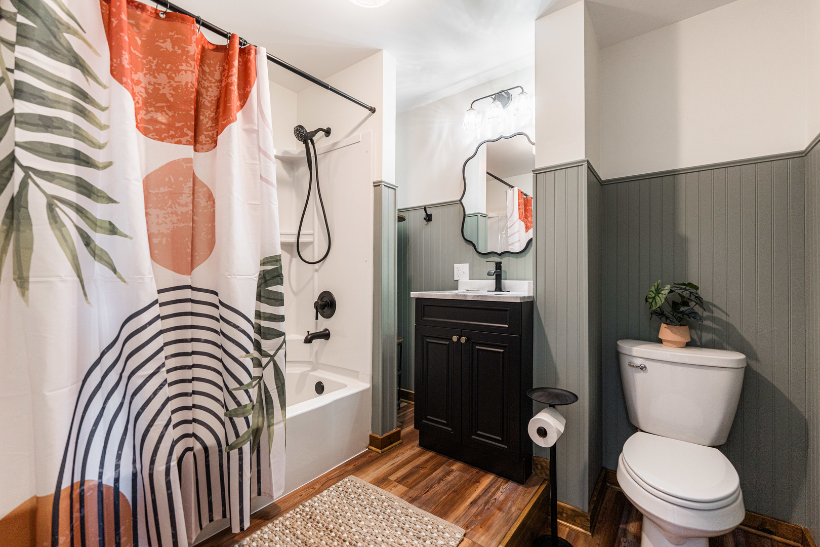 318 West State Street, Unit 318 Sycamore, IL 60178 - Photo 16 of 21 a bathroom with a sink a toilet and shower