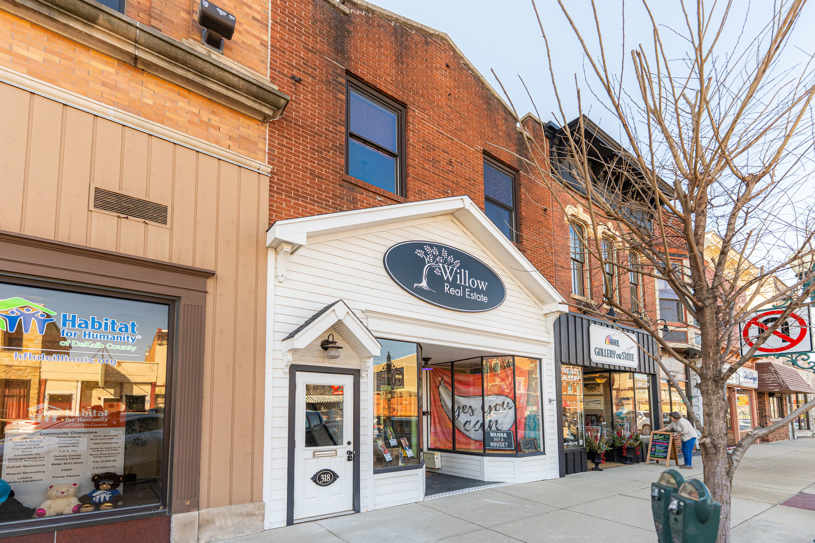 318 West State Street, Unit 318 Sycamore, IL 60178 - Photo 21 of 21 a view of a brick building with a large tree