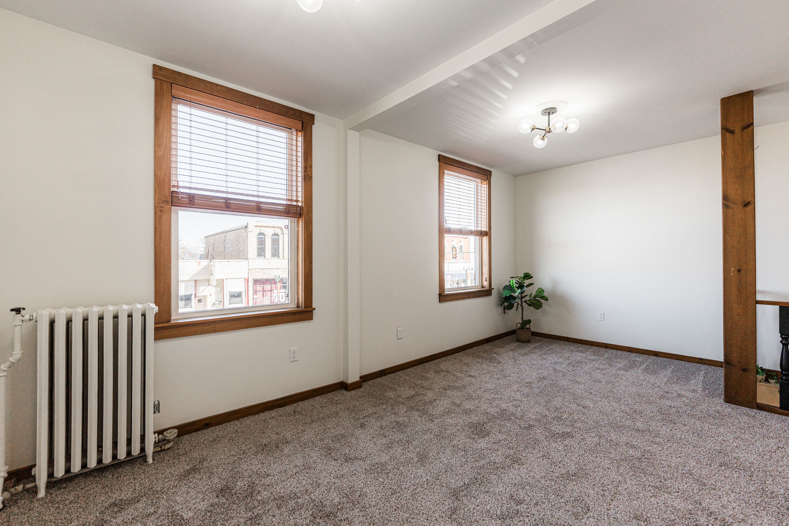 318 West State Street, Unit 318 Sycamore, IL 60178 - Photo 8 of 21 an empty room with windows