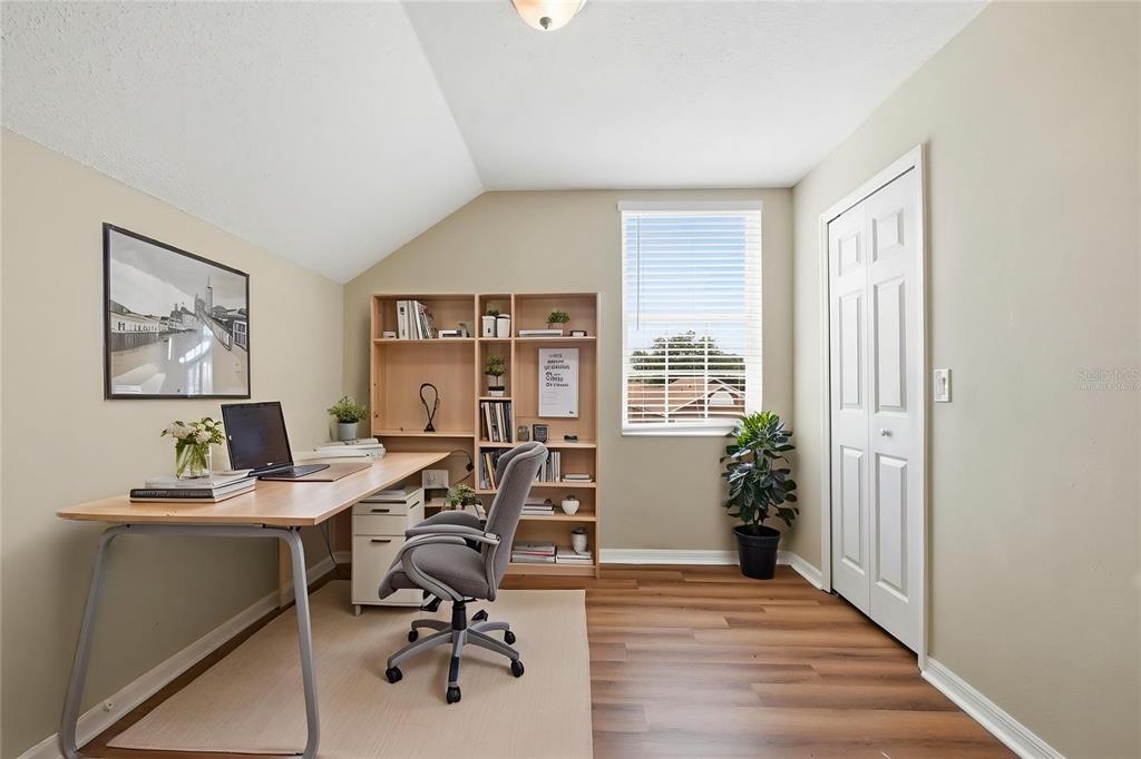 617 Greys Ferry Road Orlando, FL 32811 - Photo 5 of 35 a view of a workspace with furniture and a window