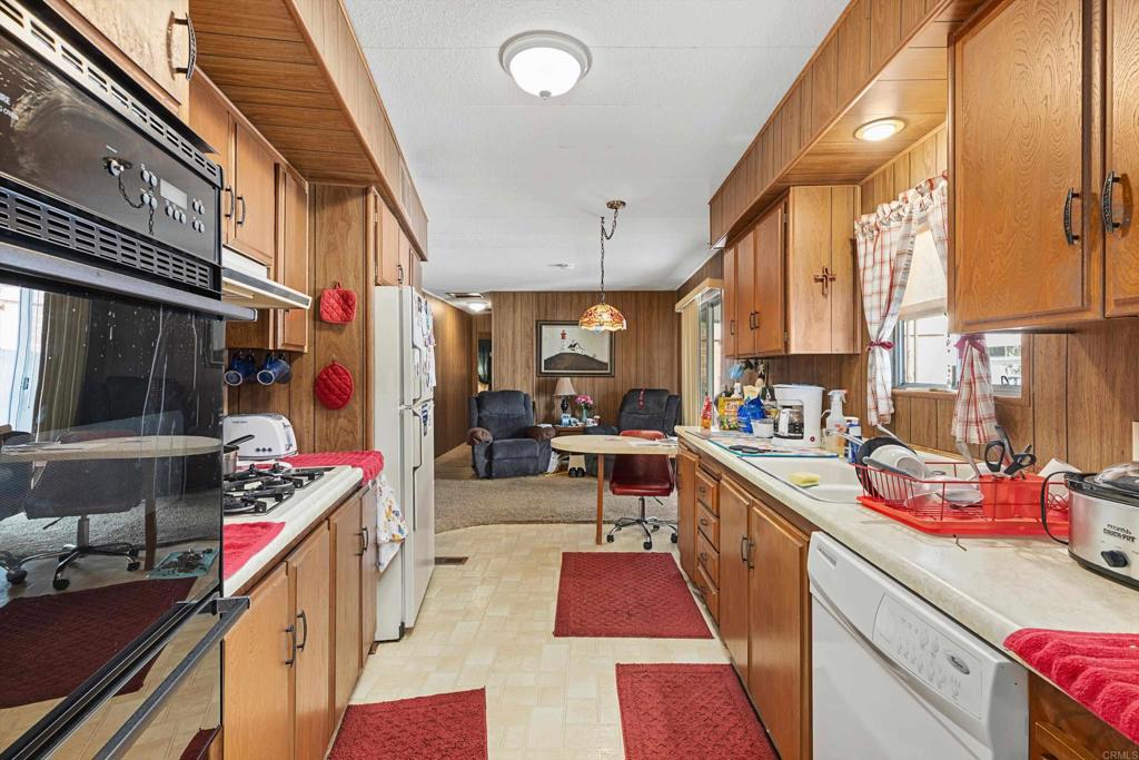 65 Brookside Lane Oceanside, CA 92056 - Photo 12 of 28 a kitchen filled a counter and appliances