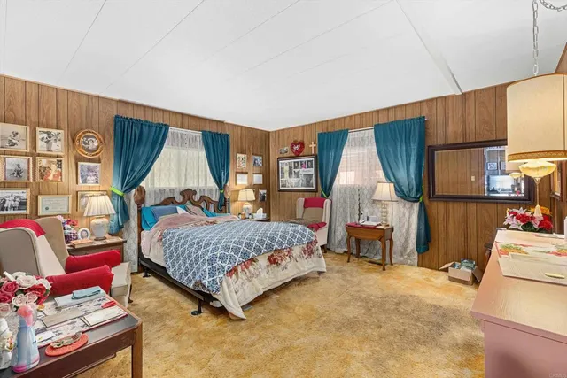 a bedroom with a bed and dresser