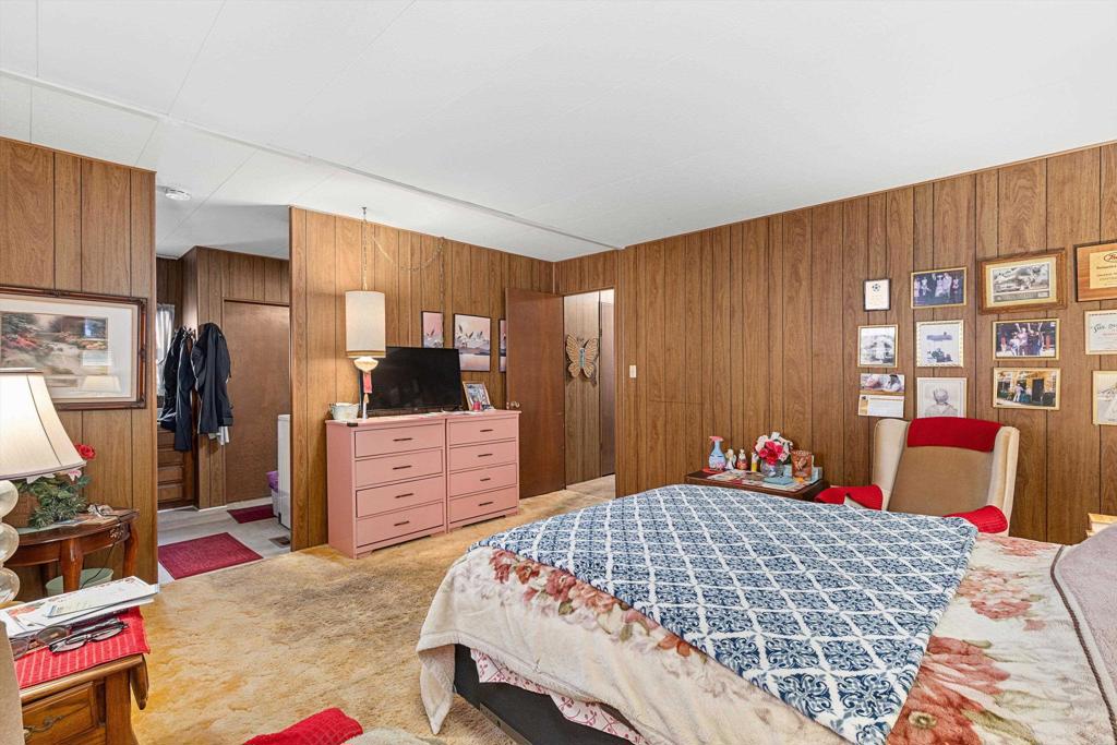 65 Brookside Lane Oceanside, CA 92056 - Photo 17 of 28 a bedroom with a bed and dresser