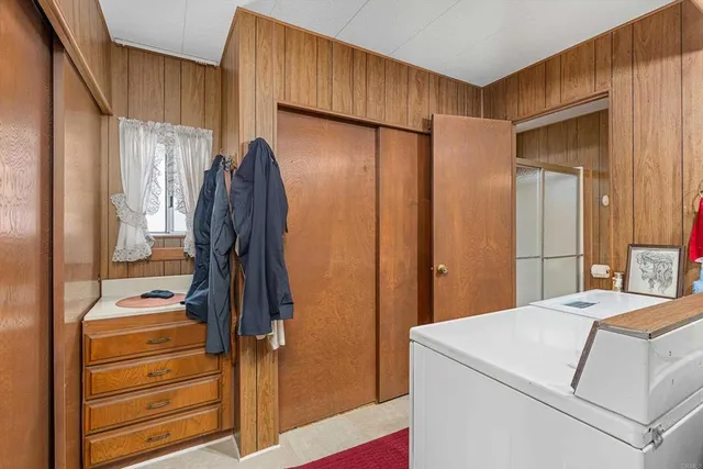 a bathroom with a sink vanity mirror and toilet