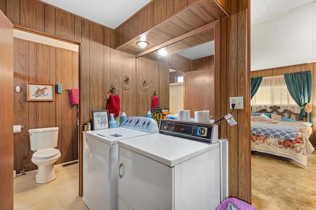 65 Brookside Lane Oceanside, CA 92056 - Photo 19 of 28 a bathroom with a sink vanity mirror and toilet
