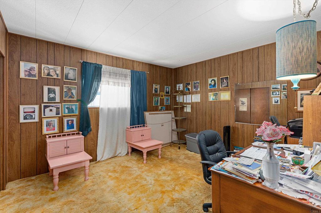 65 Brookside Lane Oceanside, CA 92056 - Photo 21 of 28 a room with furniture and a wooden floor