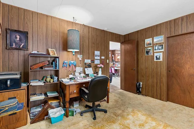 a bathroom with a sink mirror and vanity