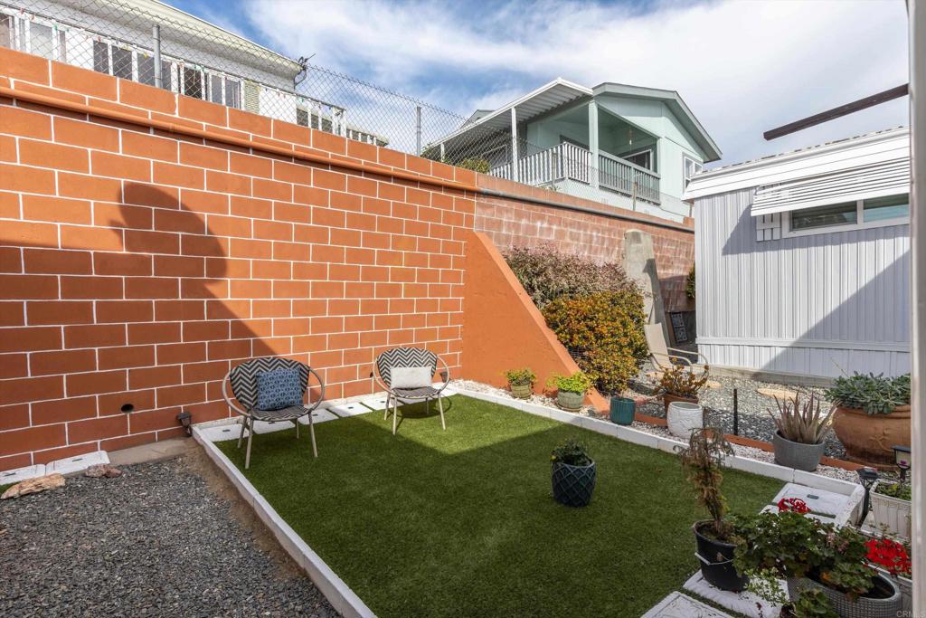 65 Brookside Lane Oceanside, CA 92056 - Photo 24 of 28 a front view of a house with a yard