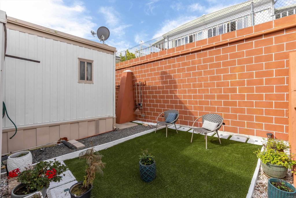 65 Brookside Lane Oceanside, CA 92056 - Photo 25 of 28 a backyard of a house with seating space