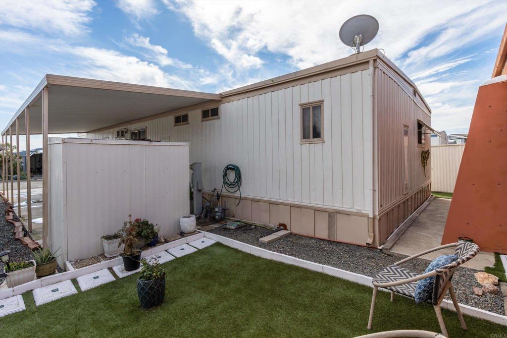 65 Brookside Lane Oceanside, CA 92056 - Photo 26 of 28 a bathroom with a sink and mirror