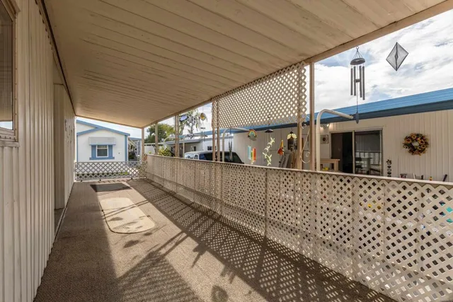 a view of a porch with wooden floor