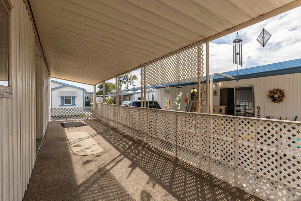 65 Brookside Lane Oceanside, CA 92056 - Photo 4 of 28 a view of a porch with wooden floor
