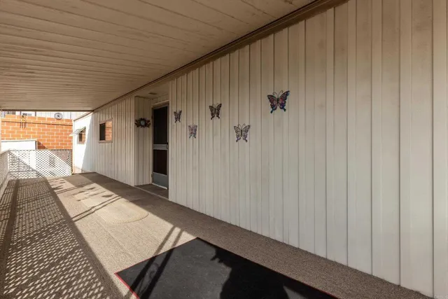 a view of a livingroom with furniture and windows