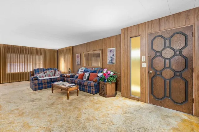 a bedroom with furniture and window