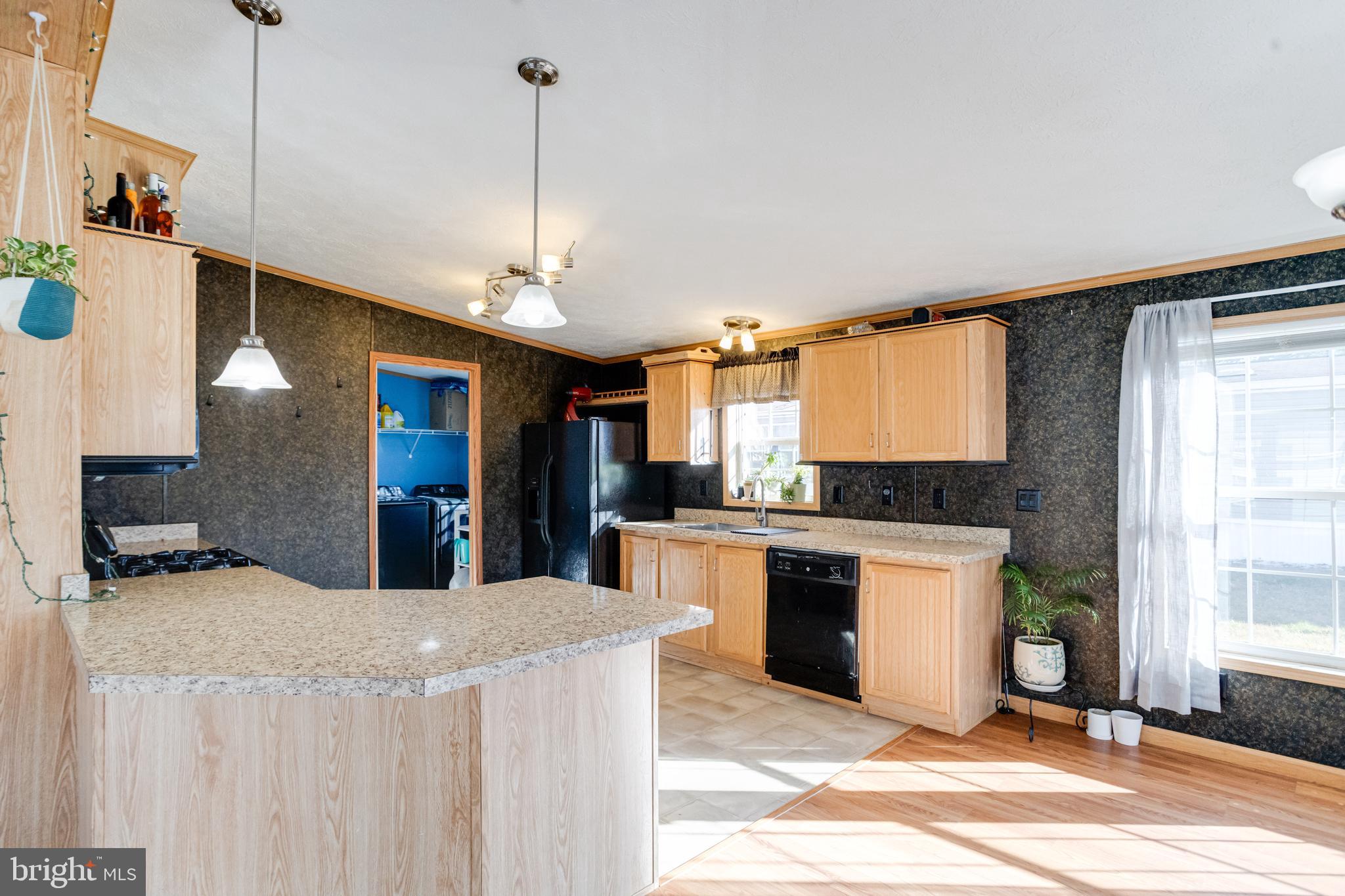 488 North Patuxent Road, Unit 18A Odenton, MD 21113 - Photo 12 of 34 a kitchen with stainless steel appliances granite countertop a sink a stove and a refrigerator