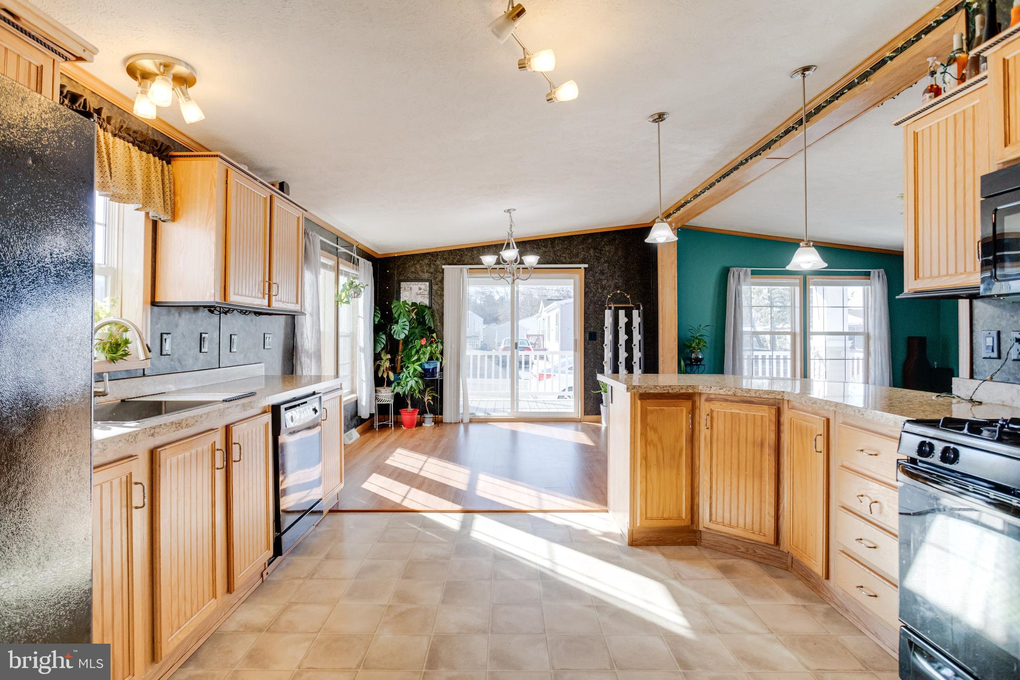 488 North Patuxent Road, Unit 18A Odenton, MD 21113 - Photo 15 of 34 a large white kitchen with a large window