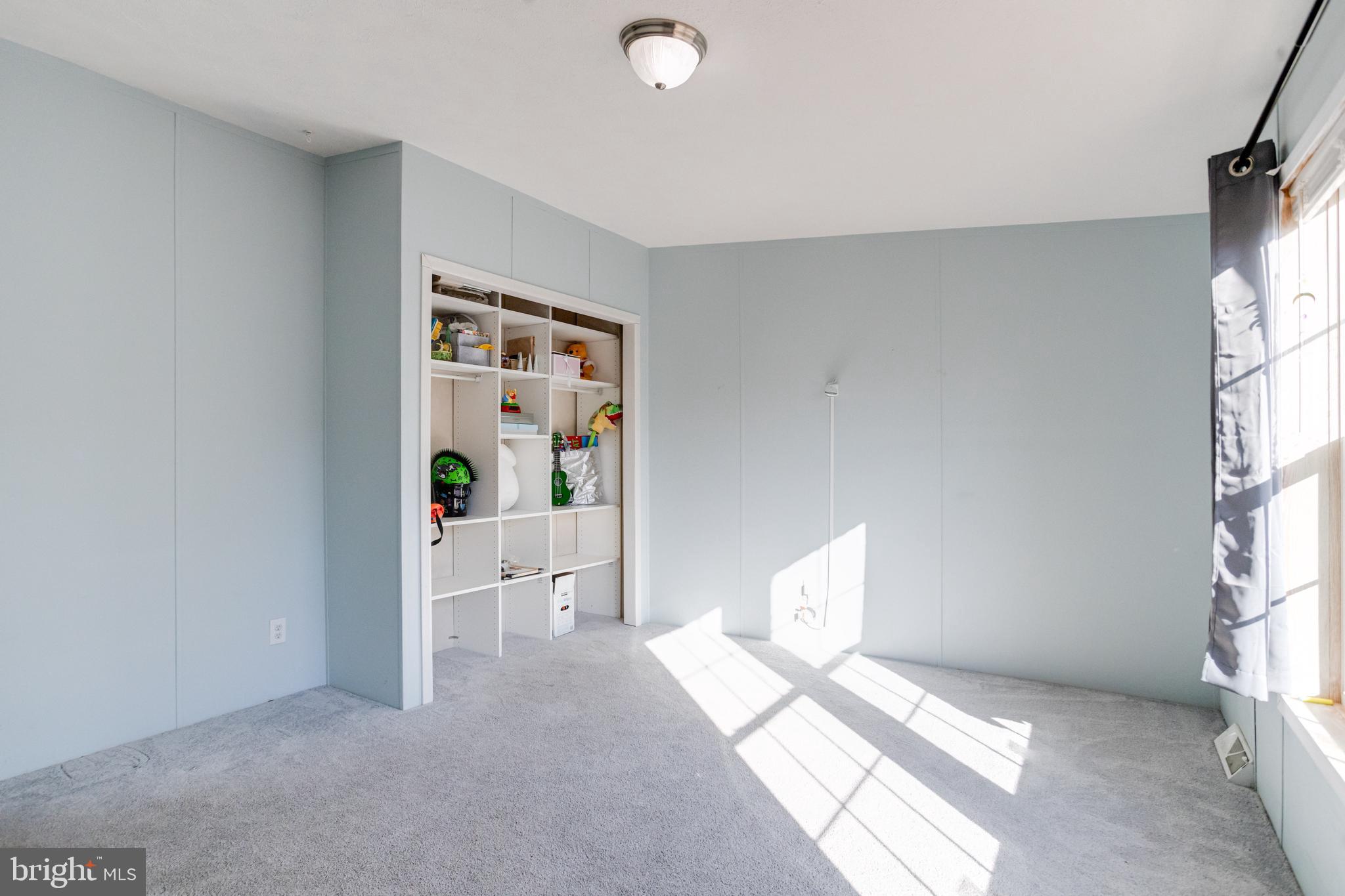 488 North Patuxent Road, Unit 18A Odenton, MD 21113 - Photo 25 of 34 a view of a bedroom with window and hardwood floor