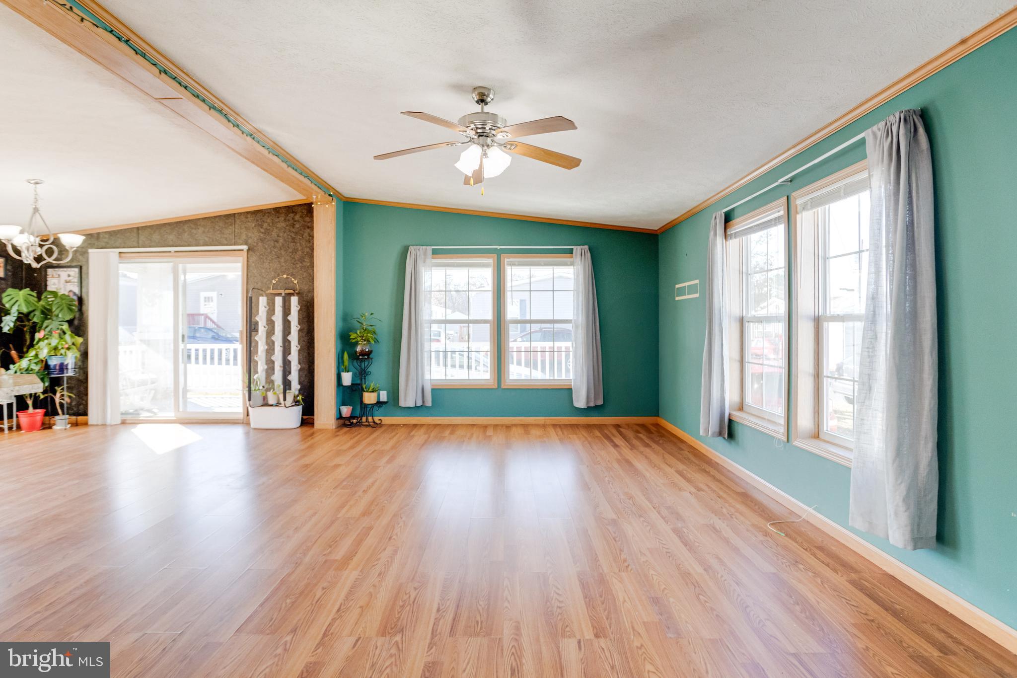 488 North Patuxent Road, Unit 18A Odenton, MD 21113 - Photo 4 of 34 a view of an empty room with wooden floor and a window