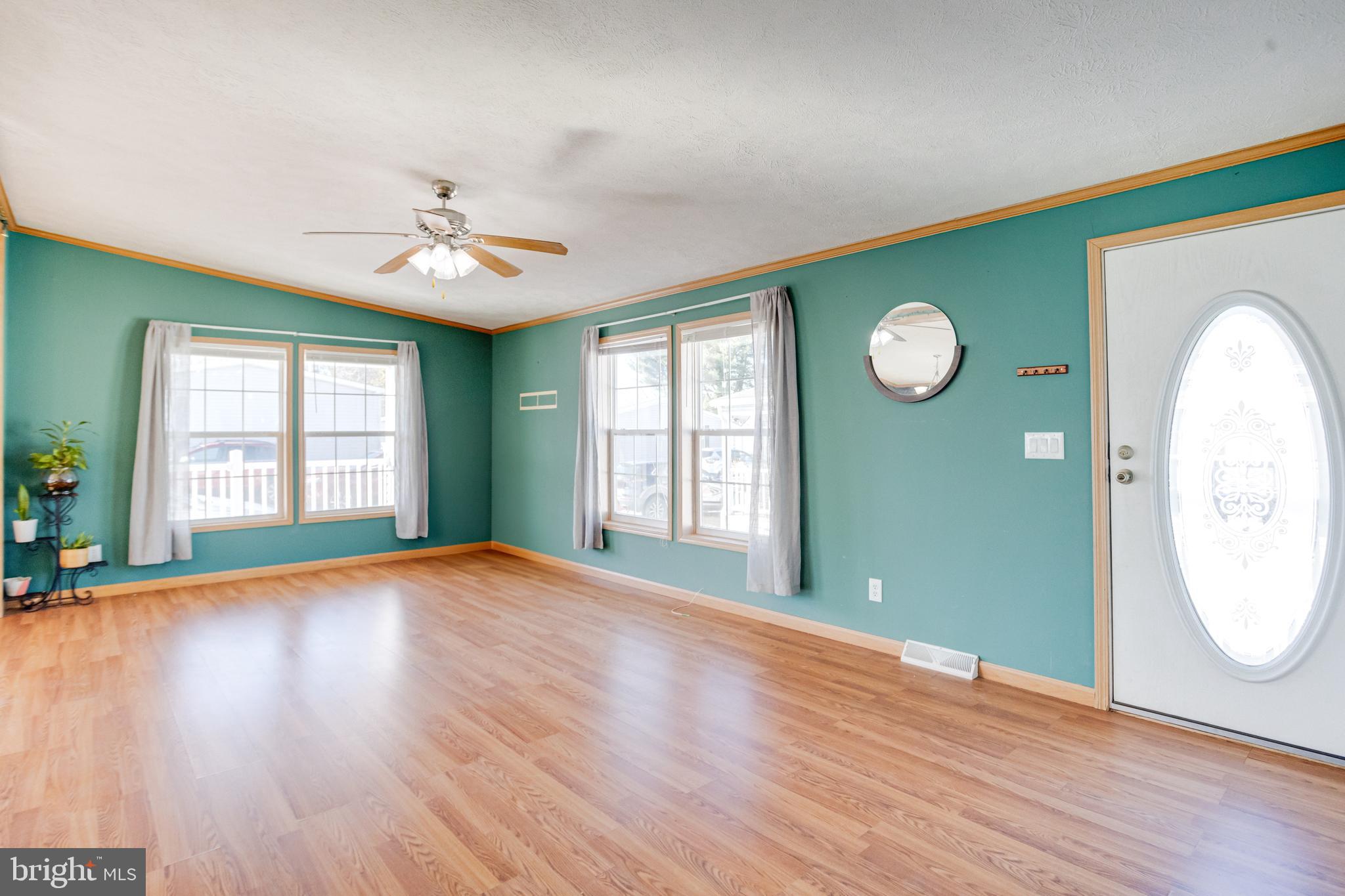 488 North Patuxent Road, Unit 18A Odenton, MD 21113 - Photo 5 of 34 a view of an empty room with window and wooden floor