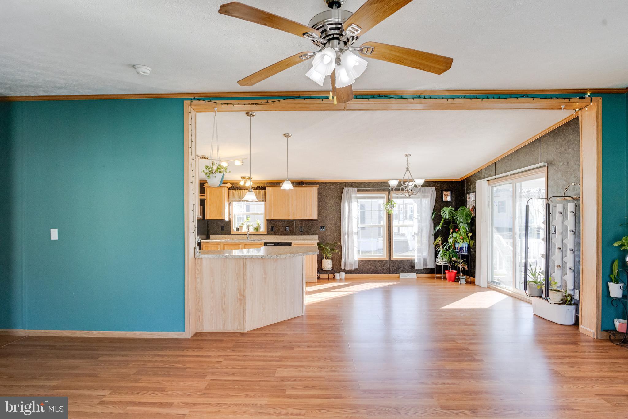 488 North Patuxent Road, Unit 18A Odenton, MD 21113 - Photo 8 of 34 a view of an empty room with window and wooden floor