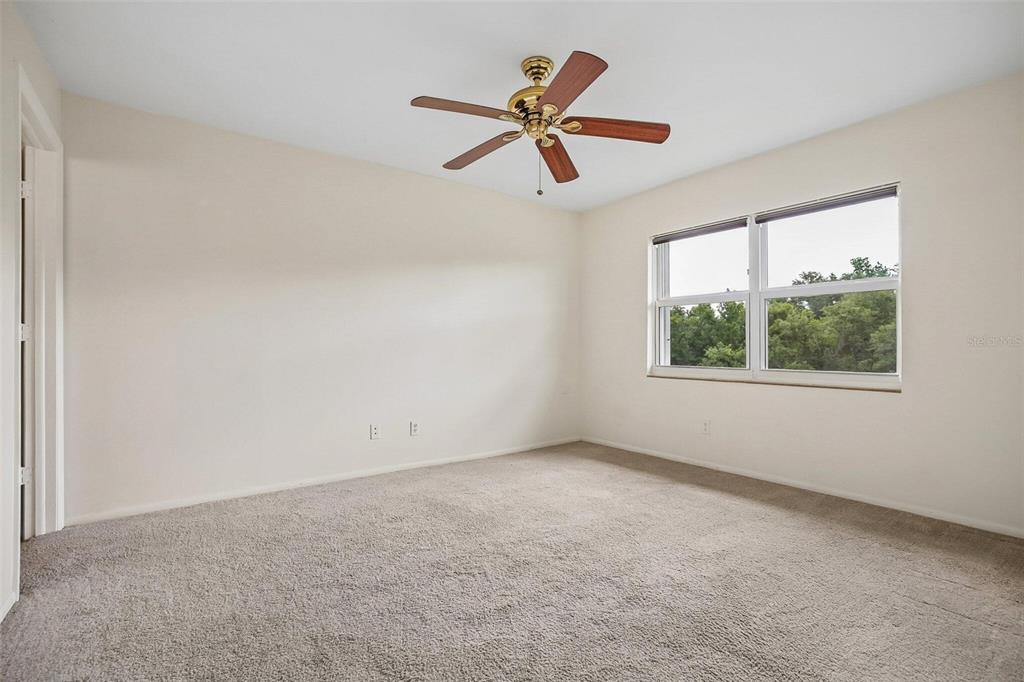 26485 Rampart Boulevard, Unit A27 Punta Gorda, FL 33983 - Photo 19 of 27 a view of an empty room with a window