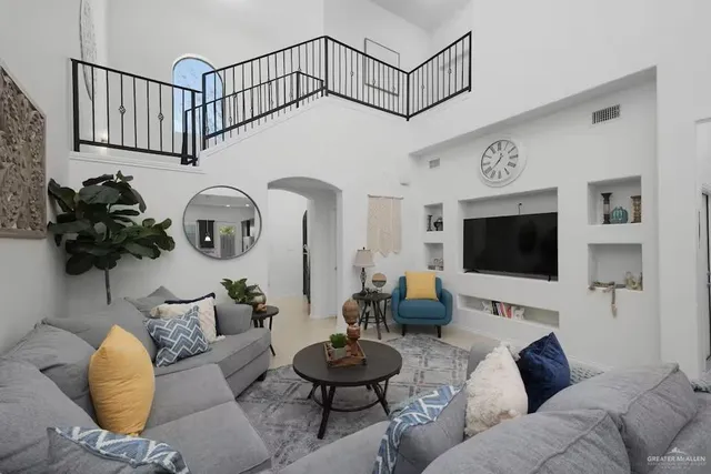 a living room with furniture and a flat screen tv