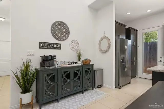 a view of a dinning room with kitchen area