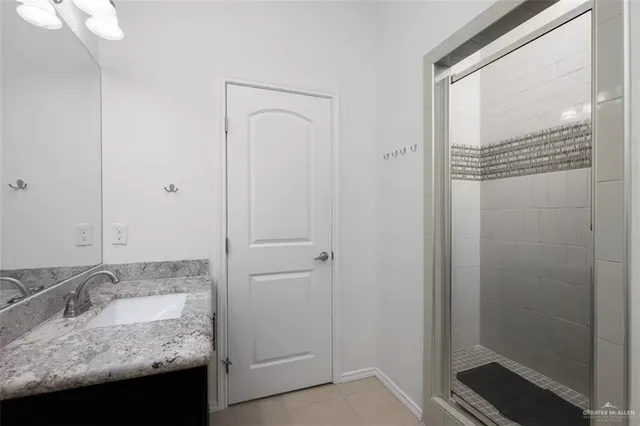 a spacious bedroom with a bed and a window