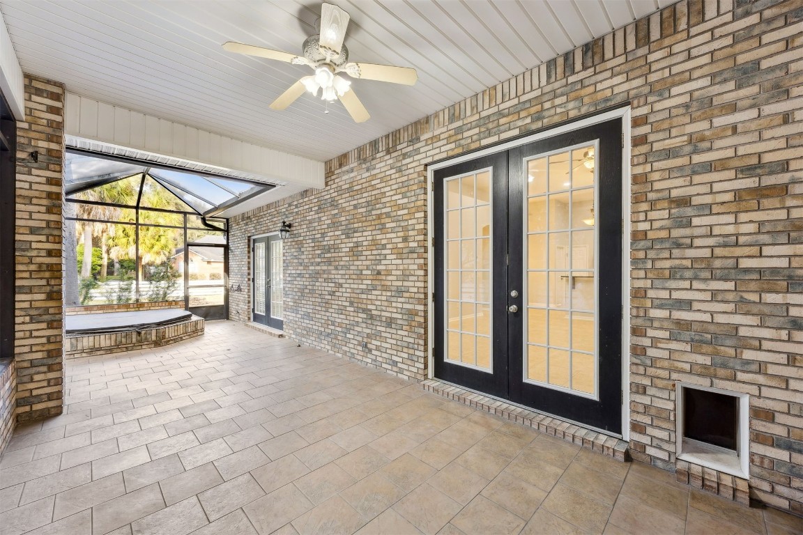 96286 Springwood Lane Fernandina Beach, FL 32034 - Photo 33 of 59 Covered, screened patio for al fresco dining, relaxing or pool/pingpong.