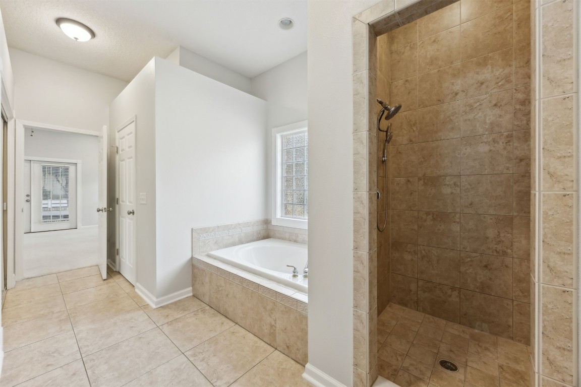 96286 Springwood Lane Fernandina Beach, FL 32034 - Photo 38 of 59 Owner's suite bathroom with tiled shower