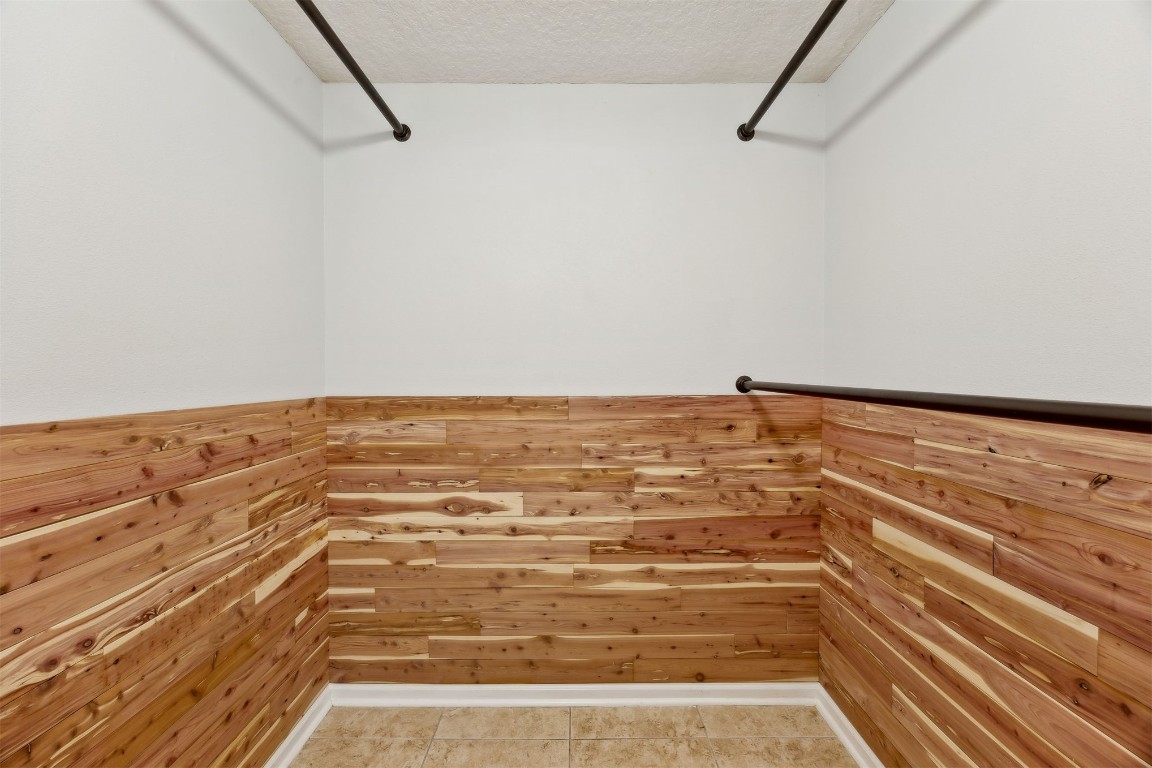 96286 Springwood Lane Fernandina Beach, FL 32034 - Photo 39 of 59 Owner's suite closet (1 of 2) lined with cedar planks