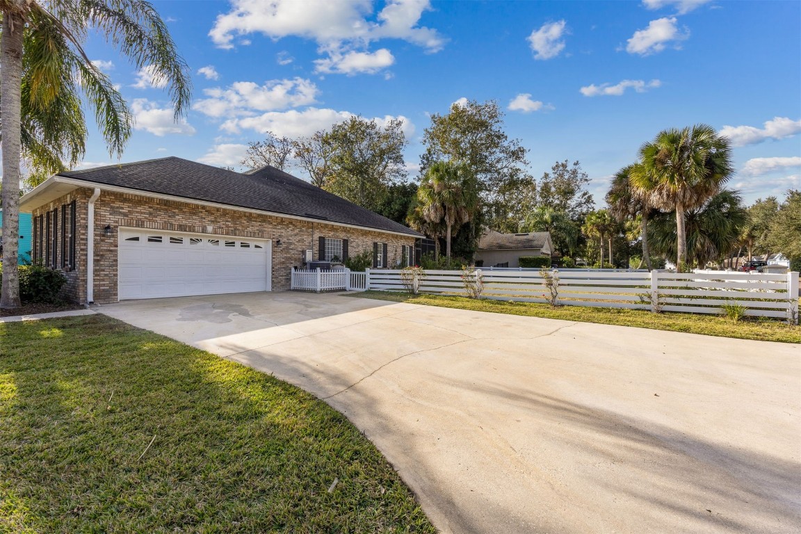 96286 Springwood Lane Fernandina Beach, FL 32034 - Photo 48 of 59 Side entry garage and driveway on corner lot-great for curb appeal