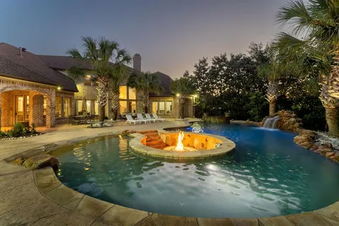 swimming pool view with a garden space
