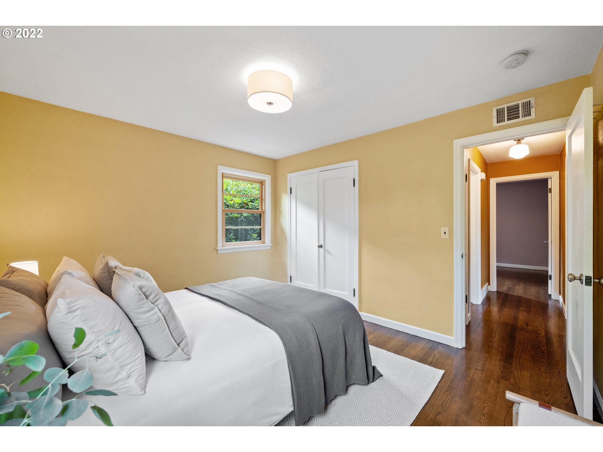 3286 Northeast Holman Street Portland, OR 97211 - Photo 15 of 25 a bedroom with a bed and a table