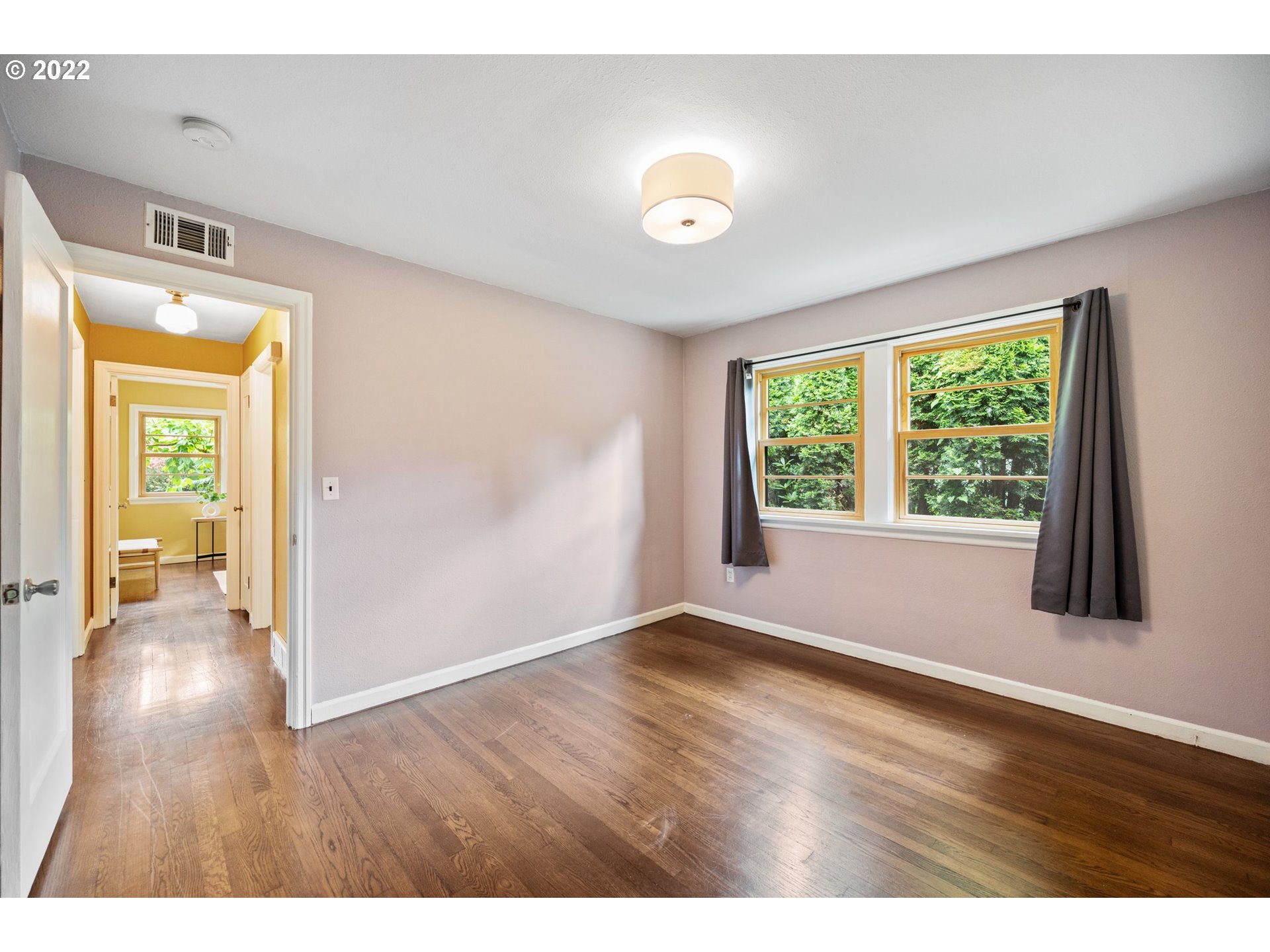 3286 Northeast Holman Street Portland, OR 97211 - Photo 16 of 25 a view of an empty room with wooden floor and a window