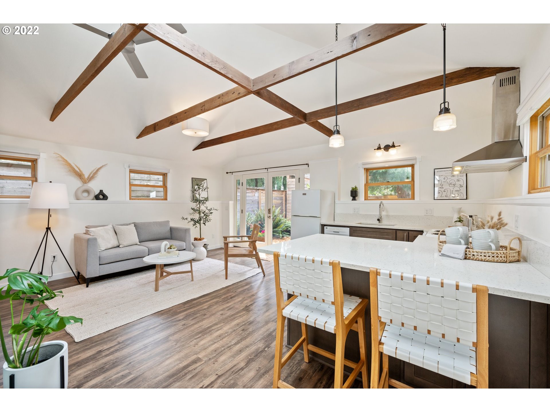 3286 Northeast Holman Street Portland, OR 97211 - Photo 2 of 25 a view of a dining room with furniture and wooden floor