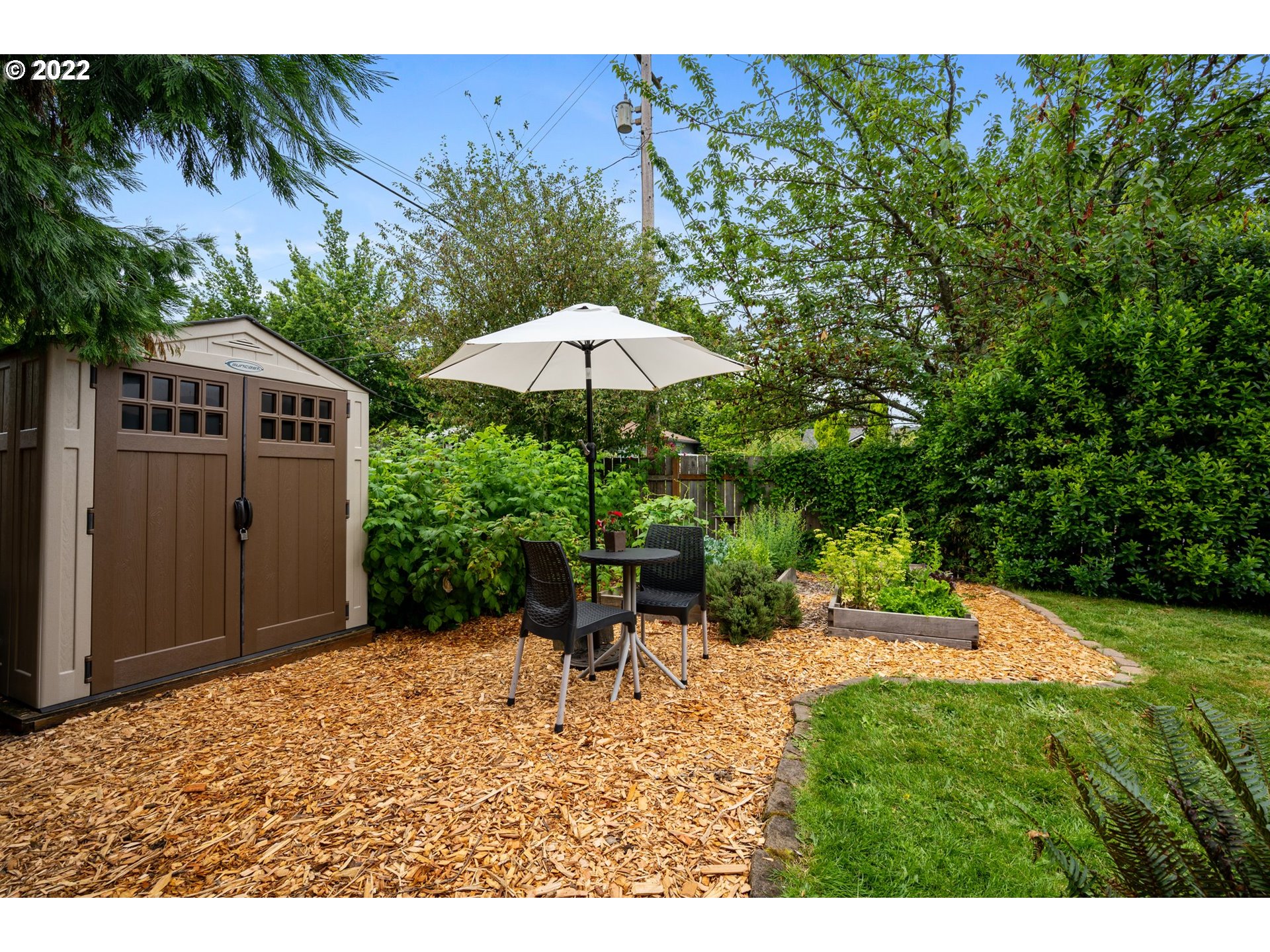 3286 Northeast Holman Street Portland, OR 97211 - Photo 23 of 25 a backyard of a house with table and chairs