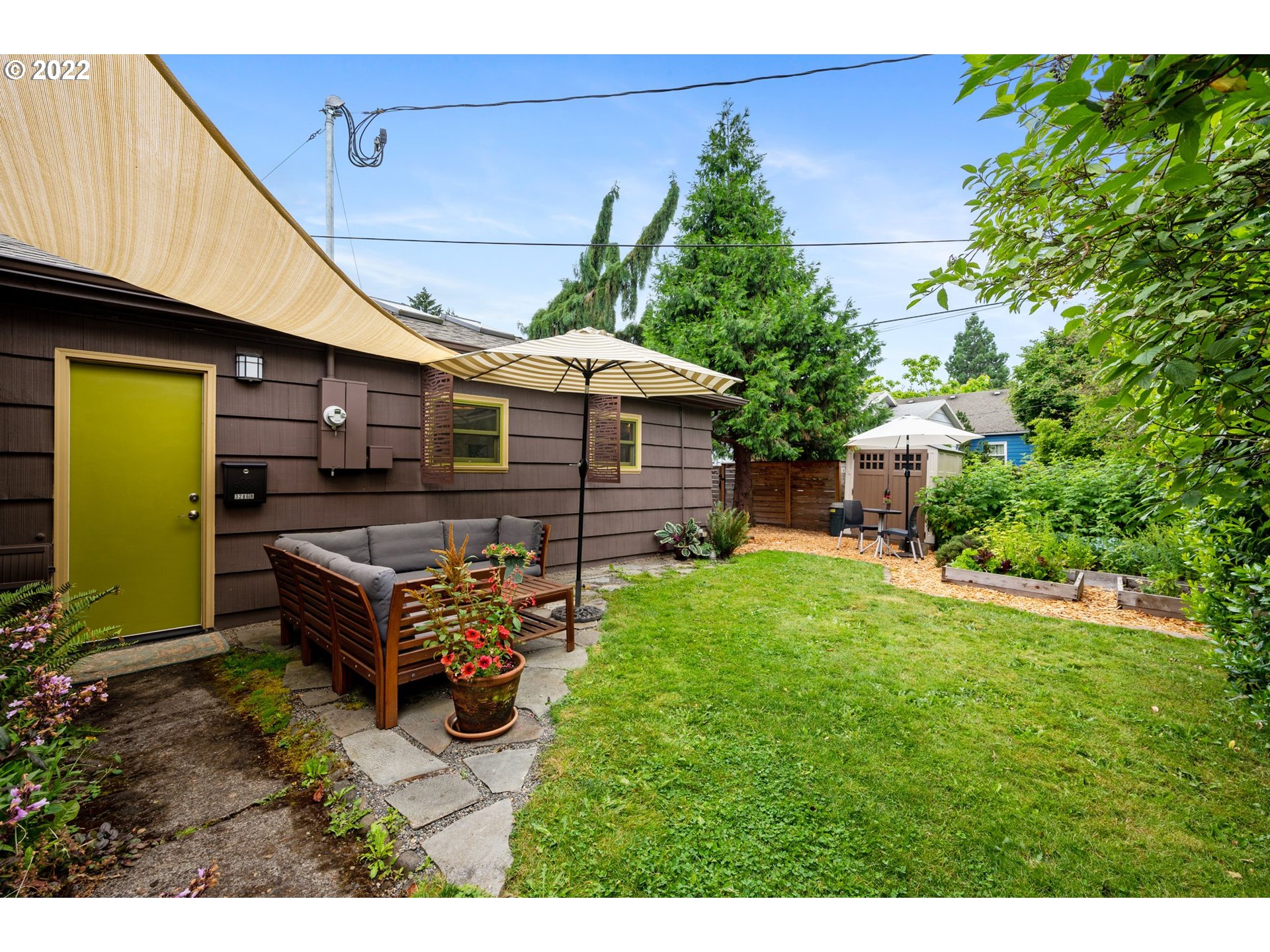 3286 Northeast Holman Street Portland, OR 97211 - Photo 24 of 25 a backyard of a house with outdoor seating
