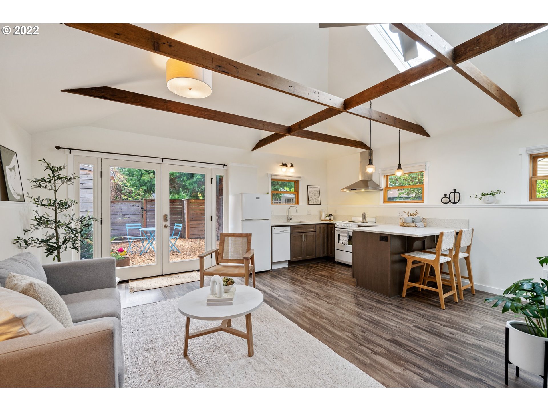 3286 Northeast Holman Street Portland, OR 97211 - Photo 3 of 25 a living room with furniture and a large window