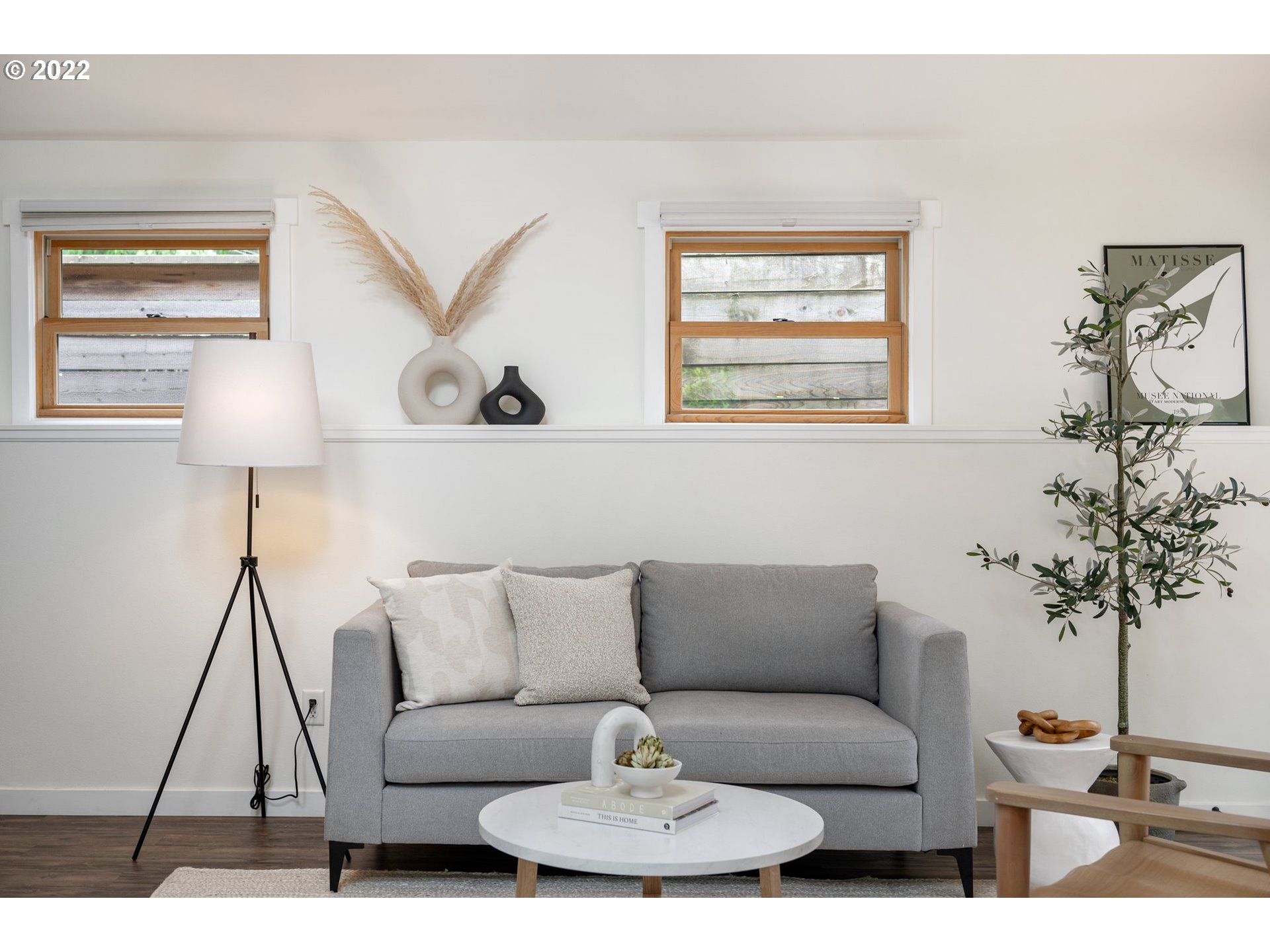 3286 Northeast Holman Street Portland, OR 97211 - Photo 6 of 25 a living room with furniture and a potted plant