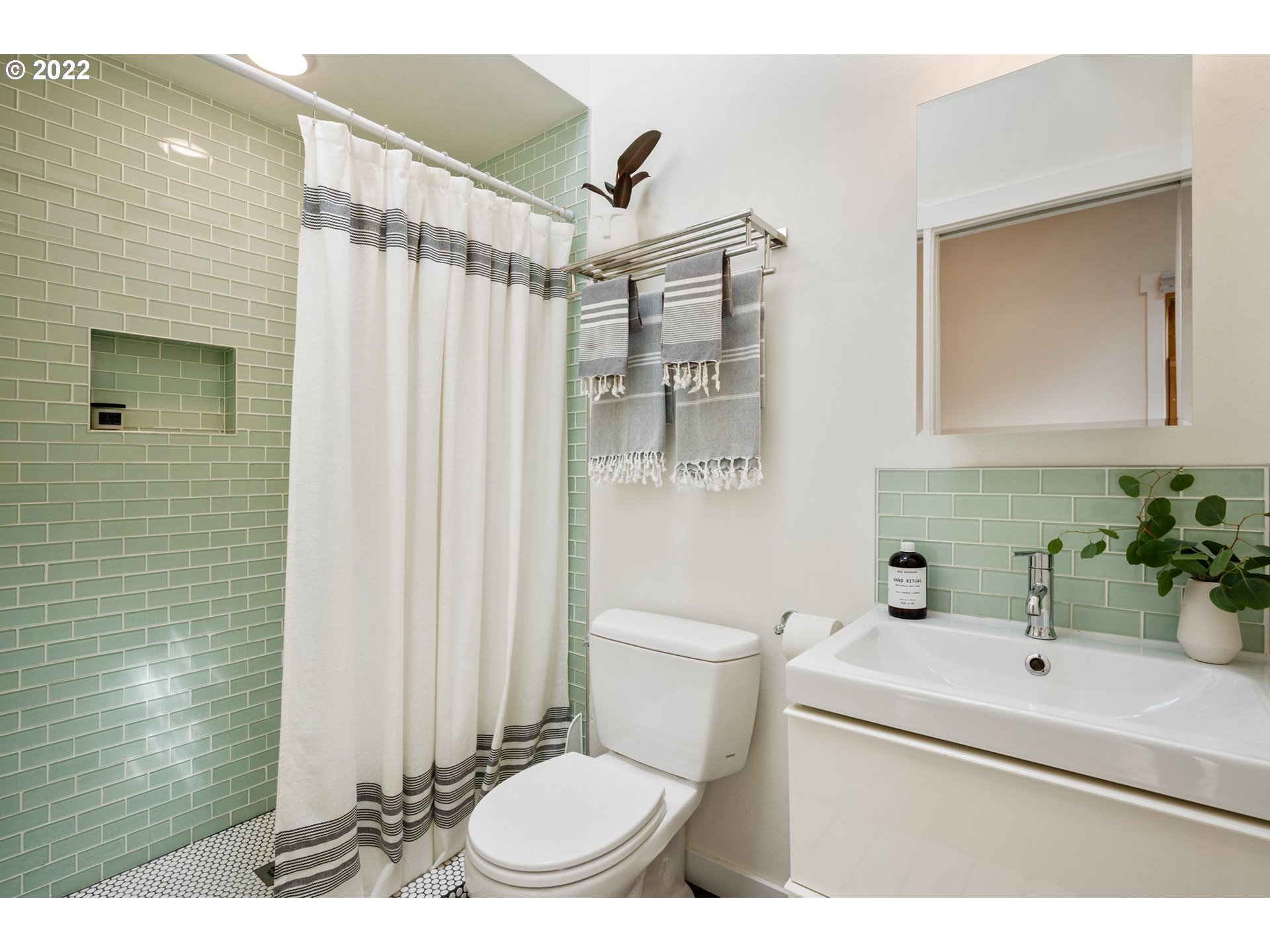 3286 Northeast Holman Street Portland, OR 97211 - Photo 8 of 25 a bathroom with a sink toilet and shower