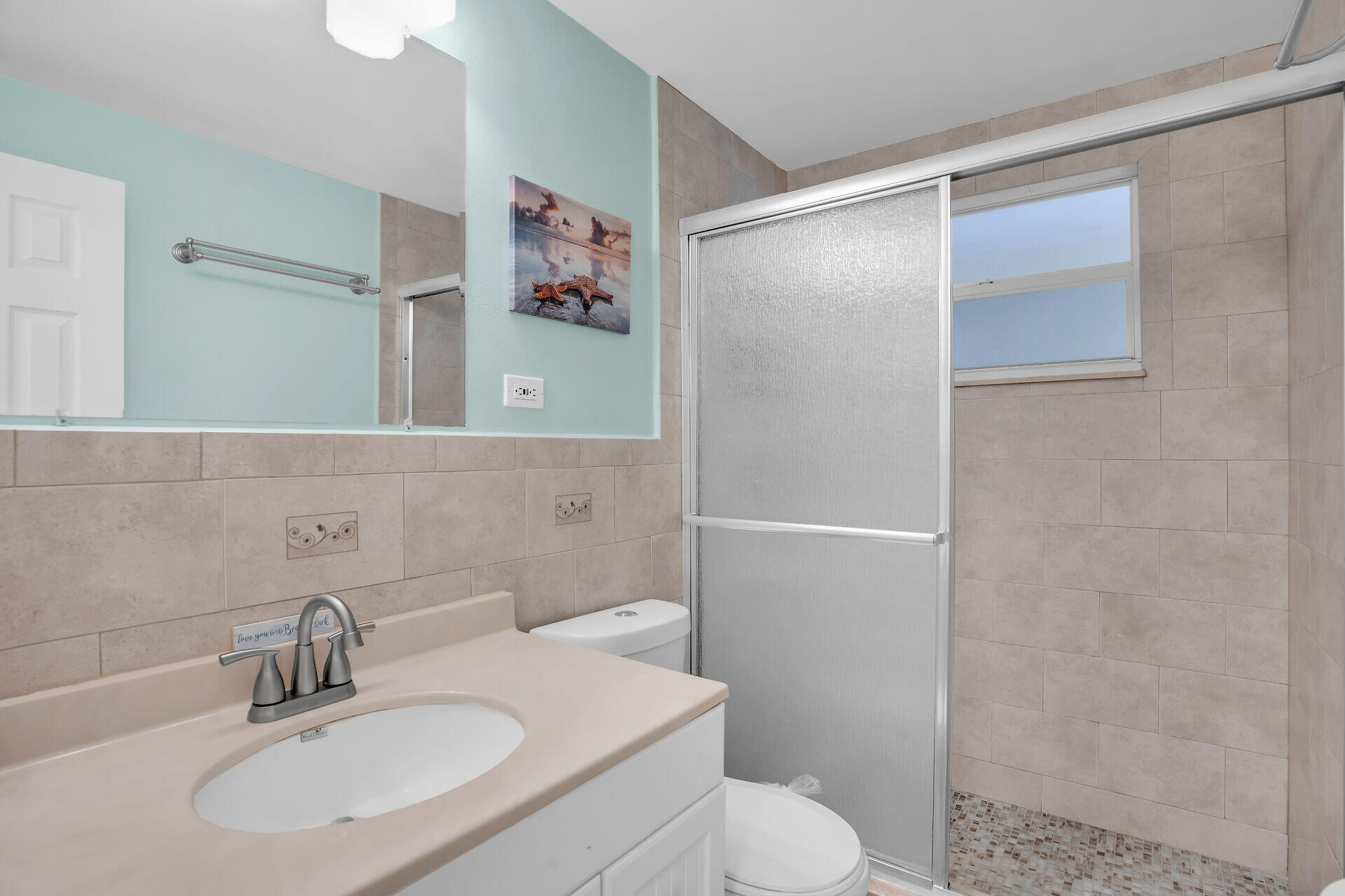 211 5th Street Key Colony Beach, FL 33051 - Photo 11 of 28 a bathroom with a sink toilet and shower