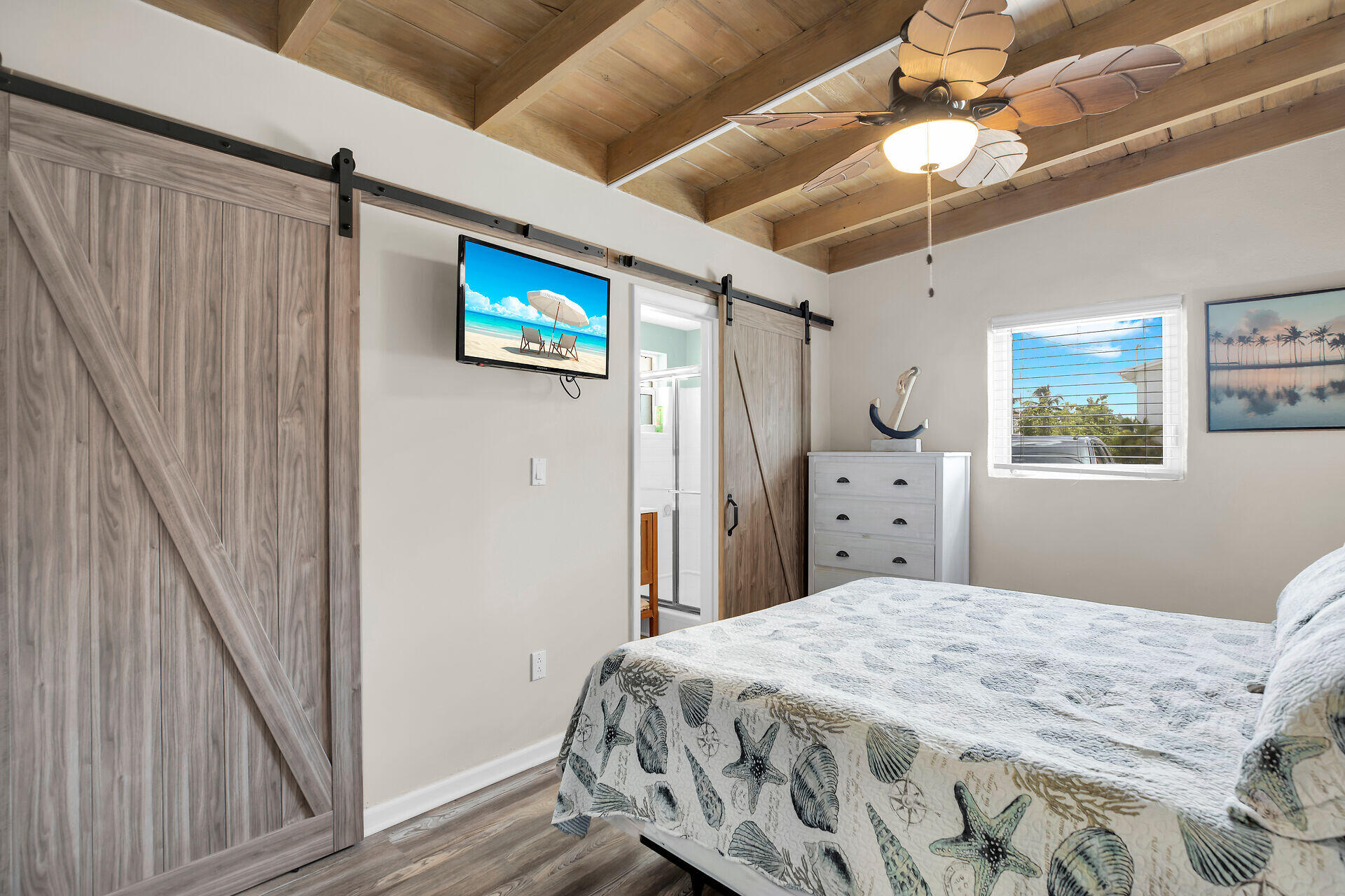211 5th Street Key Colony Beach, FL 33051 - Photo 12 of 28 a bedroom with a bed and a tv