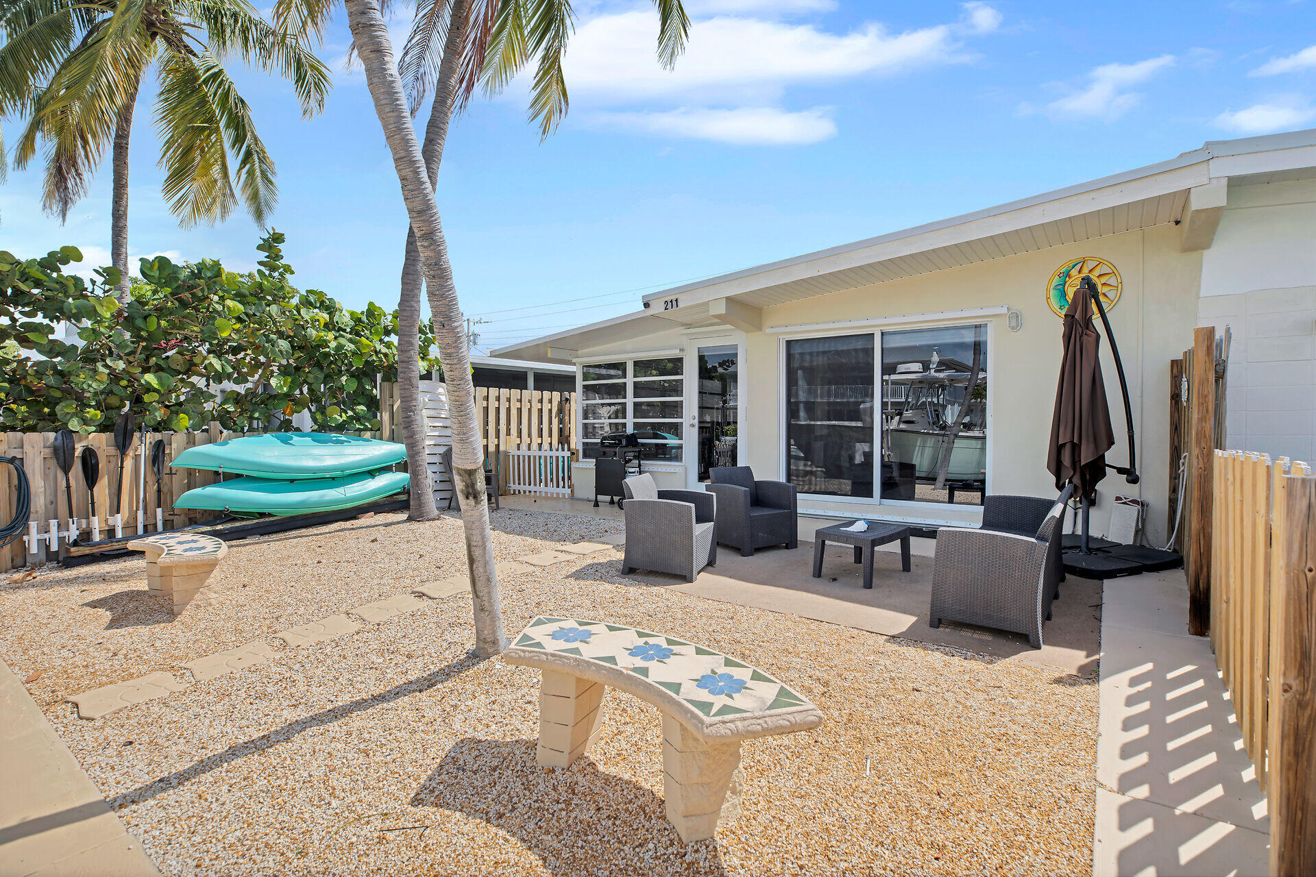 211 5th Street Key Colony Beach, FL 33051 - Photo 17 of 28 a building outdoor space with patio furniture